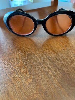 Black Oval Sunglasses with Amber Tinted Lenses